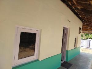 a room with a door on the side of a building at Alumpara House - Home Stay in Palakkad +5 photos