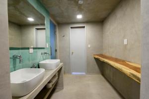 a bathroom with a white sink and a mirror at MATAMOROS 2 · Refugio Céntrico con Piscina in Oaxaca City +3 photos