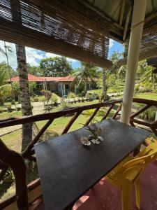 a table and chairs on the porch of a house at Cris & Mar Homestay in Burgos