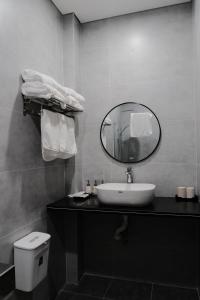 a bathroom with a sink and a mirror at Homestay SkyLight in Dong Hoi +24 photos