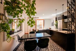 a kitchen and dining room with a table and chairs at INDEPENDENCIA 2 · Small and Modern Apt for four in Oaxaca City +2 photos