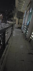 an empty hallway in a building with lights on at Home stays in Jammu