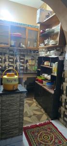 a kitchen with a table and a counter in a kitchen at Home stays in Jammu