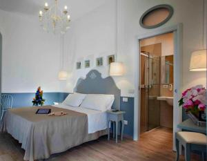 a bedroom with a bed with a christmas tree on it at Aparthotel Daniel in Bellaria-Igea Marina