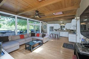 a living room with a couch and a kitchen at River View Lodge - Hot Tub And Tastings Included in Healdsburg