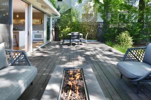 a patio with a fire pit and two chairs at Fitch St Escape - Wine Tastings Included in Healdsburg