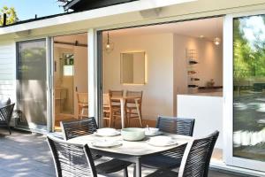 a white table and chairs on a patio at Fitch St Escape - Wine Tastings Included in Healdsburg +26 photos