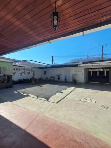 a large parking lot in a building with a wooden ceiling at La Casa del Barrio in Quetzaltenango