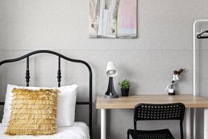 a bedroom with a desk and a bed with a pillow at Light & Simple Single Room - Peakhurst Area - Shared Bathroom in Peakhurst