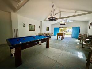 a large room with a pool table in it at Pousada Santorini Guararema in Guararema