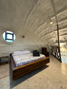 a bedroom with a bed in a large room at Animal Glamping in Pomona +57 photos