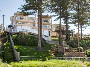a building with trees in front of it at Ocean Pines Apartments 4 in The Entrance