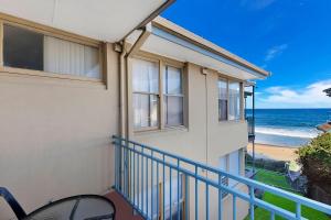 a balcony with a view of the ocean at Golden Sands Apartment 10 in The Entrance