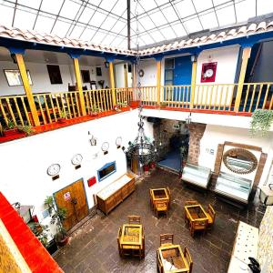 an overhead view of a building with tables and chairs at Posada Villa Mayor in Cusco
