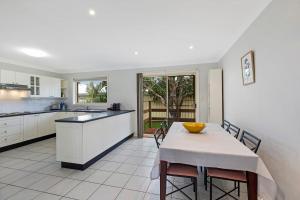 a kitchen with a table with a bowl on it at Bonnieview House in Shelly Beach