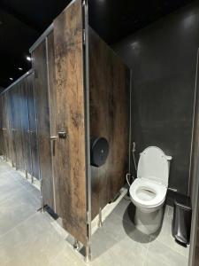 a bathroom with a toilet in a stall at Factor Inn - Old Quarter Centre in Hanoi