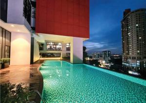 a large swimming pool on the side of a building at The Aerie in Kuala Lumpur