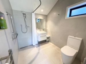 a bathroom with a toilet and a sink and a shower at The Quarters Unit 2 - Lake Tekapo in Lake Tekapo