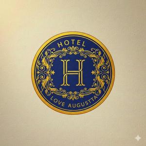a blue and gold hotel sign on a wall at Hotel Love Augustta in São Paulo