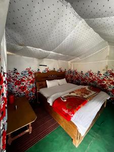 a bedroom with a bed in a tent at Mayadeep Resort and Hostels in Chopta