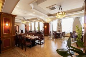 a dining room with a table and chairs at Royal House Hotel 2 in Ulaanbaatar
