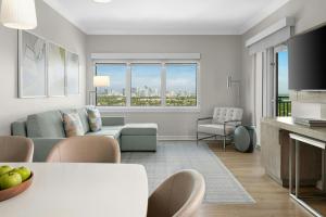 a living room with a couch and a table at Marriott Beachplace Towers 2BD in Fort Lauderdale