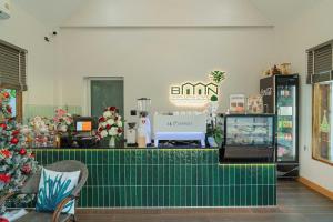 a store with a christmas tree and a checkout counter at Baansiwalin in Phra Nakhon Si Ayutthaya