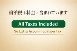 a green sign that reads all taxes included no extra accommodation tax at Our-Turn Traditional Machiya near Heian Shrine in Kyoto