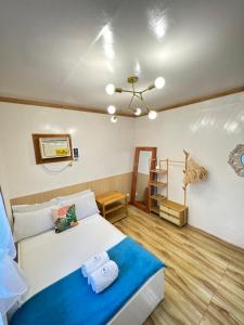 a bedroom with a bed and a ladder in it at KAMURAYAW SIARGAO in General Luna
