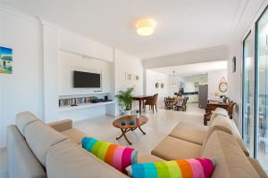 a living room with a couch and a table at Villa Giovanni in Faliraki