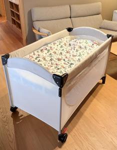 a hospital bed in a living room with a couch at Maru Izumiyacho in Kyoto