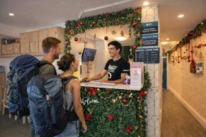 a group of people standing around a counter in a store at Tequila Sunrise Potts Point in Sydney