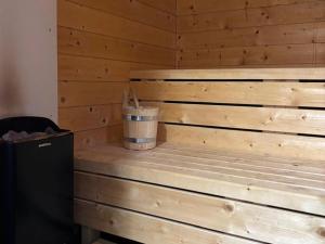 a wooden sauna with a trash can in a room at Chalet in Turracher Höhe with Ski Slope Access in Turracher Hohe