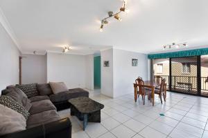 a living room with a couch and a table at Pelican Place in The Entrance