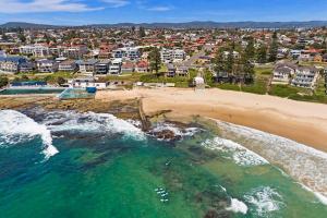 an aerial view of a beach and a city at Pelican Place in The Entrance