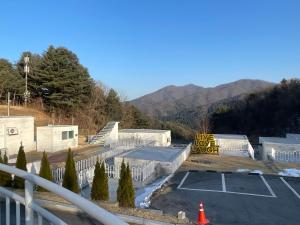 a view of a parking lot with a sign on it at Over The Mountain in Gapyeong +96 photos