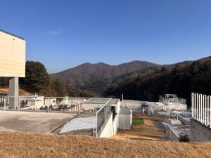 a skate park with mountains in the background at Over The Mountain in Gapyeong