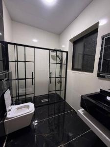 a bathroom with a toilet and a sink at Suf Hills Cabin in Jerash +6 photos