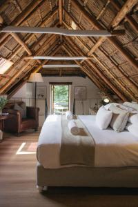 a bedroom with a large bed in a attic at Weltevreden Estate in Stellenbosch +131 photos