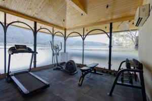 a gym with a view of a body of water at Saltstayz Autograph - Rishikesh Near Triveni Ghat in Rishīkesh