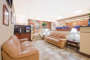 a waiting room with leather couches and a pharmacy at Days Inn by Wyndham Gettysburg in Gettysburg