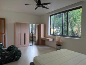 a bedroom with a bed and a ceiling fan at Luxurious Villa with Private Indoor Pool in Bophut +2 photos