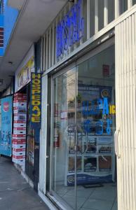 a store front of a store with a display window at Hallpa Ica in Ica