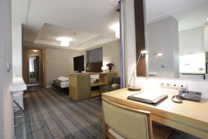 TV a/nebo společenská místnost v ubytování Housez Suites & Apartments Special Class