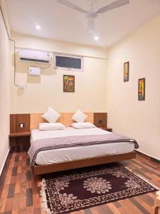 a bedroom with a large bed with a rug at Shivay Hotel & Resort in Dhārchula +7 photos