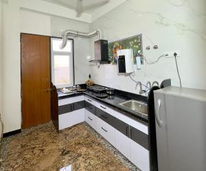 a kitchen with a sink and a counter at Sagar Villa Udaipur in Udaipur