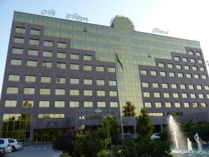 a large building with a sign on top of it at Ak Altyn in Ashgabat