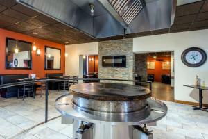 a large room with a large wine barrel on a table at Econo Lodge in Sudbury