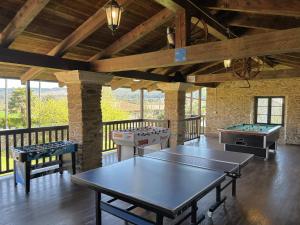 a large room with ping pong tables in it at Casa Bama in Bama
