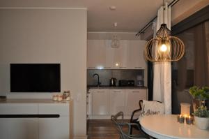 Kuchyňa alebo kuchynka v ubytovaní Apartament Prestige & Sea Horyzont 613